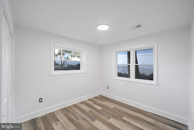 spare room featuring hardwood / wood-style flooring