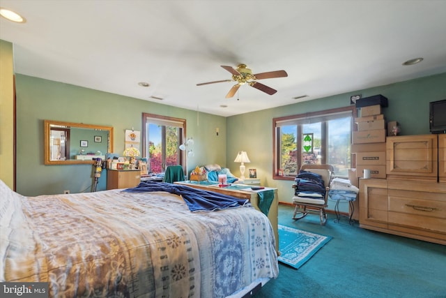 carpeted bedroom featuring ceiling fan