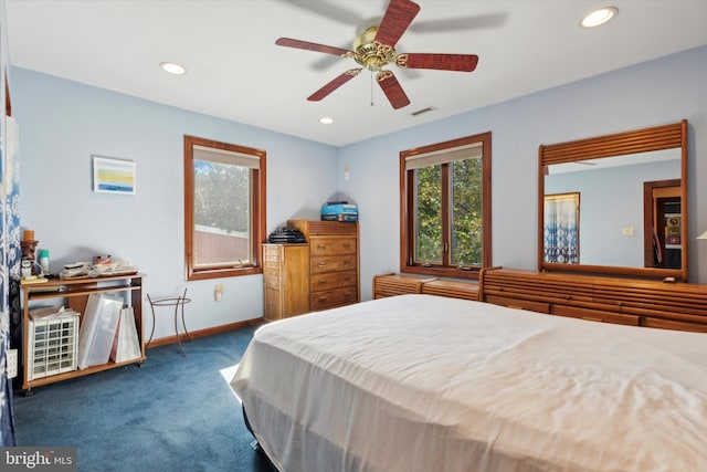 bedroom with dark carpet and ceiling fan