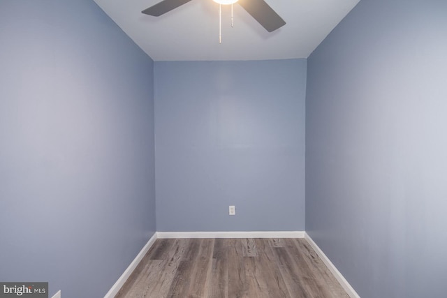 spare room featuring hardwood / wood-style flooring and ceiling fan