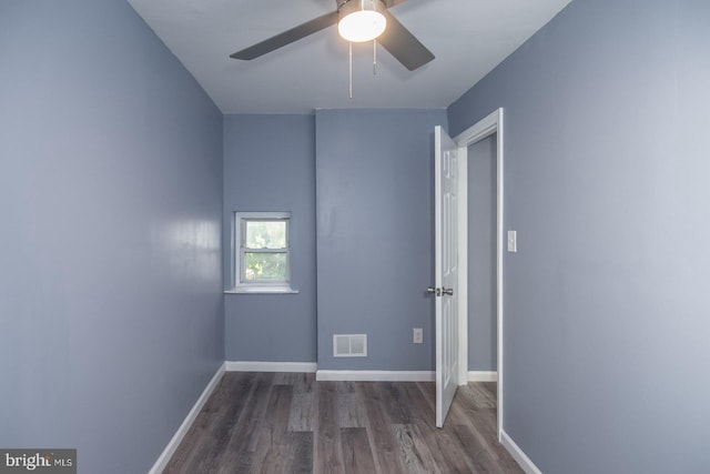 spare room with hardwood / wood-style floors and ceiling fan