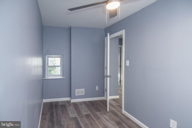 spare room with ceiling fan and hardwood / wood-style floors