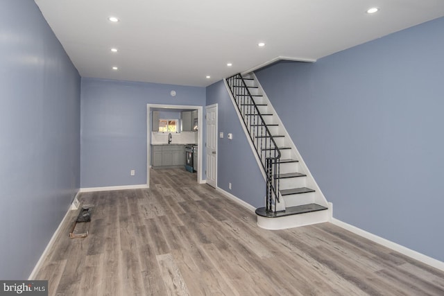 interior space with sink and light hardwood / wood-style floors