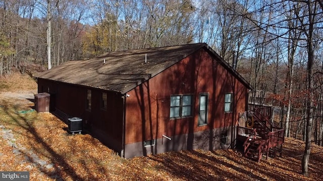 view of side of home featuring central AC unit