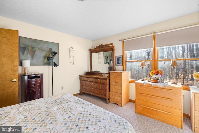 bedroom featuring light carpet