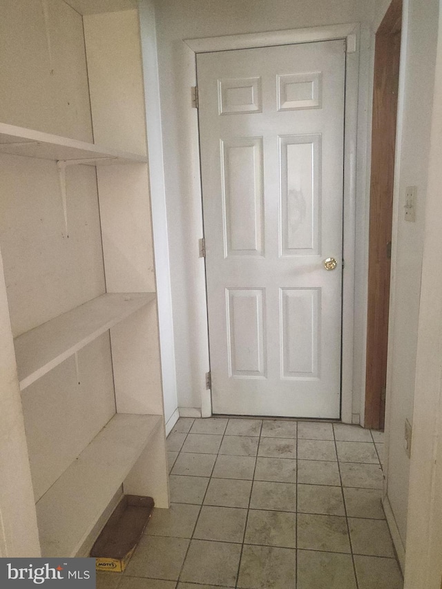 interior space featuring light tile patterned floors