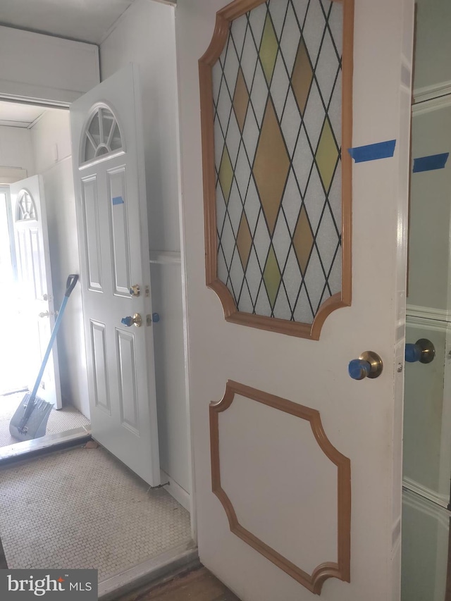 view of carpeted entrance foyer