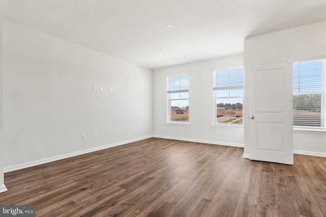 unfurnished room featuring dark hardwood / wood-style floors