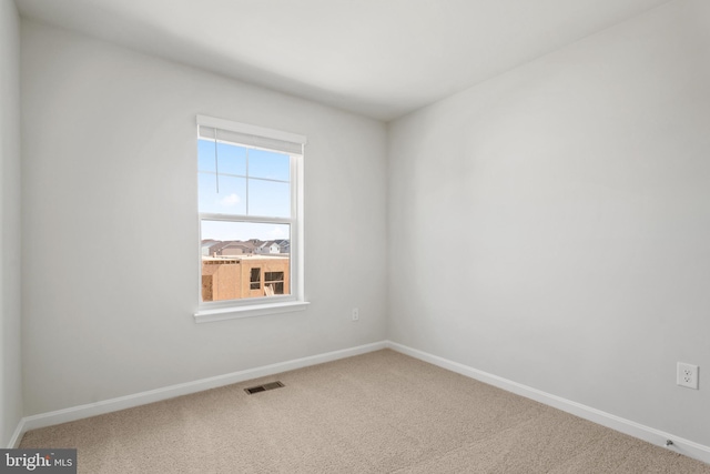 view of carpeted spare room