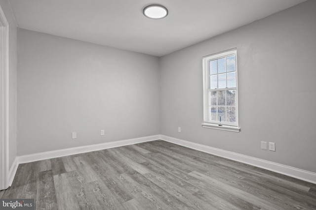 spare room featuring hardwood / wood-style floors