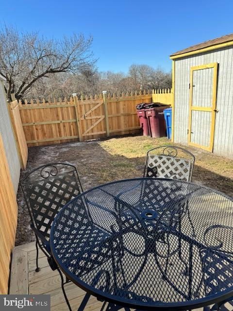 view of patio / terrace with a storage unit