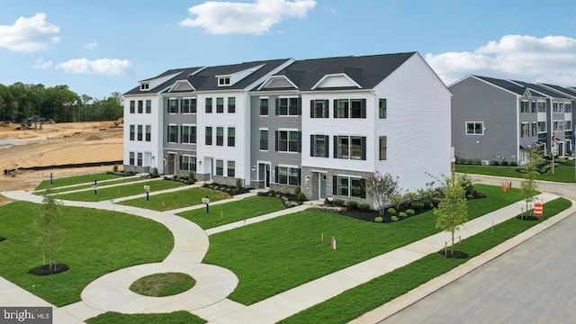 view of front facade with a front lawn