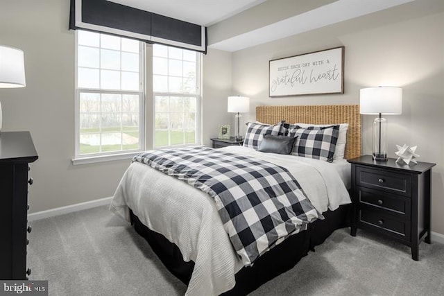 bedroom featuring light colored carpet