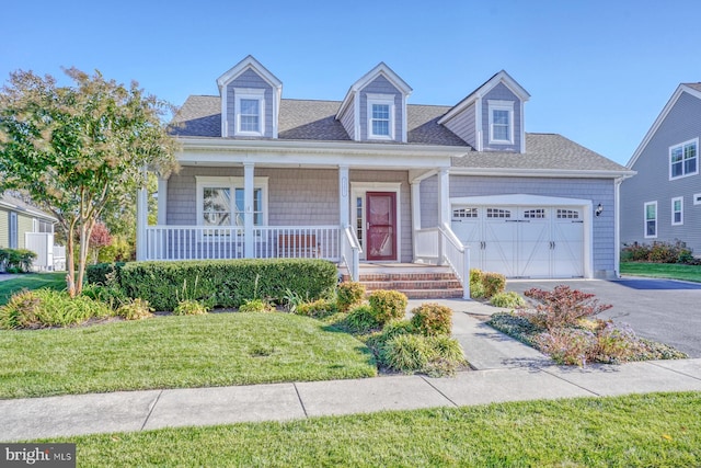 cape cod house with a front yard, covered porch, and a garage