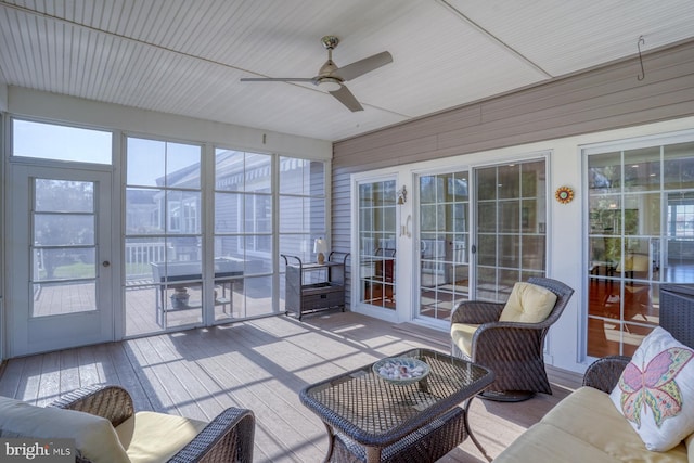 sunroom featuring ceiling fan