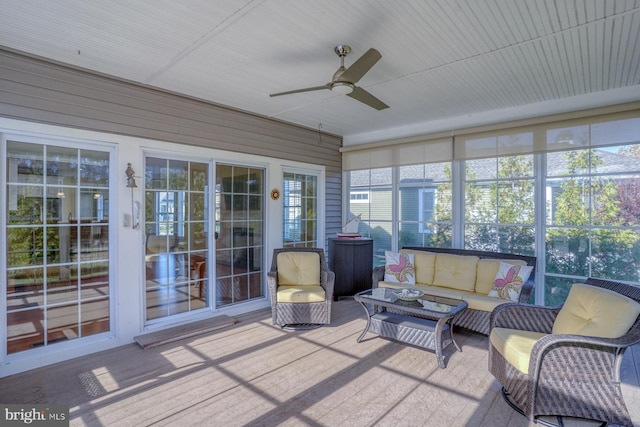 sunroom / solarium with ceiling fan