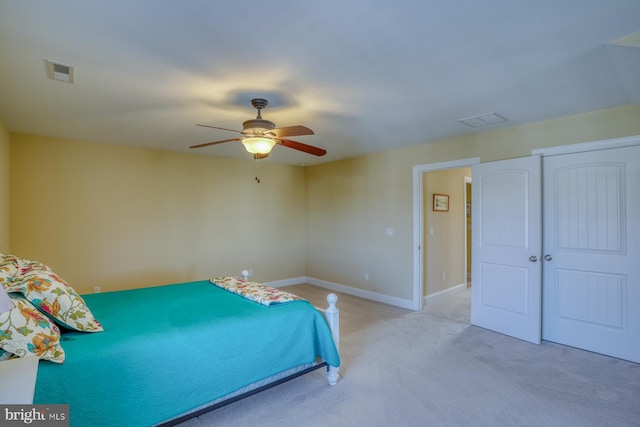 unfurnished bedroom featuring ceiling fan and light carpet