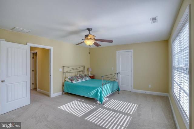 unfurnished bedroom featuring ceiling fan and light colored carpet