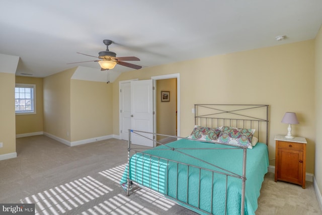 bedroom featuring ceiling fan and light carpet