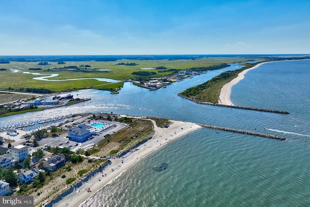 bird's eye view featuring a water view and a view of the beach