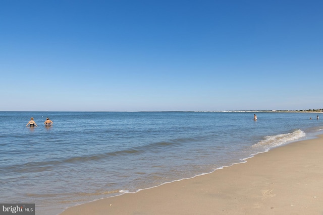 view of water feature with a beach view