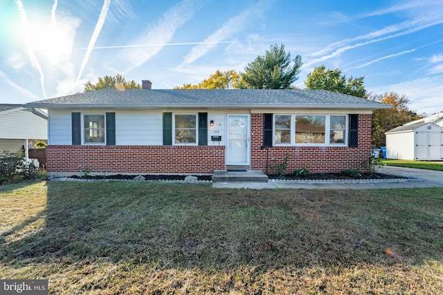 single story home featuring a front yard