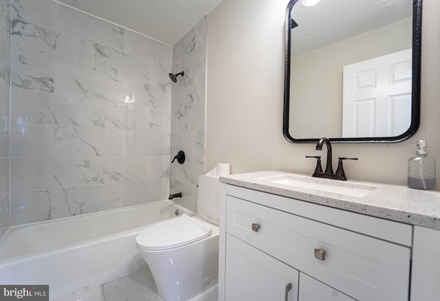 full bathroom featuring toilet, tiled shower / bath, and vanity