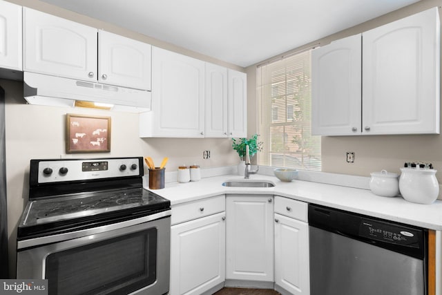 kitchen with appliances with stainless steel finishes, white cabinets, and sink