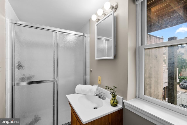 bathroom with vanity and walk in shower