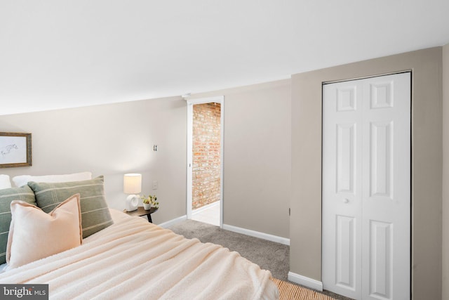 carpeted bedroom with a closet