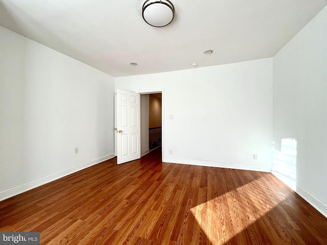 spare room featuring hardwood / wood-style floors