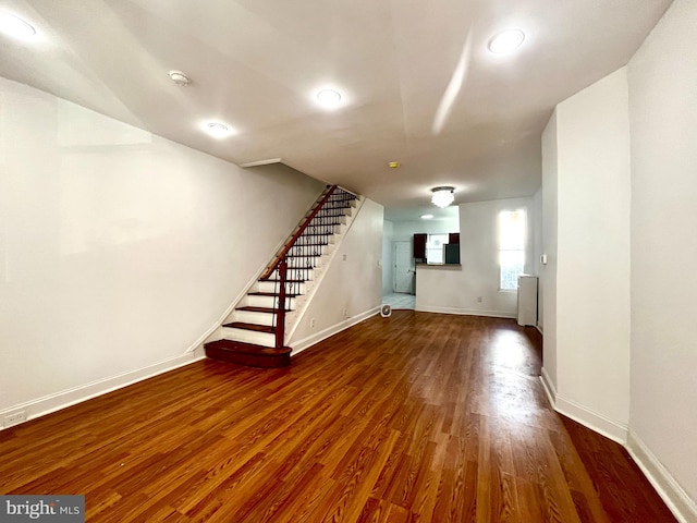 basement featuring dark hardwood / wood-style floors