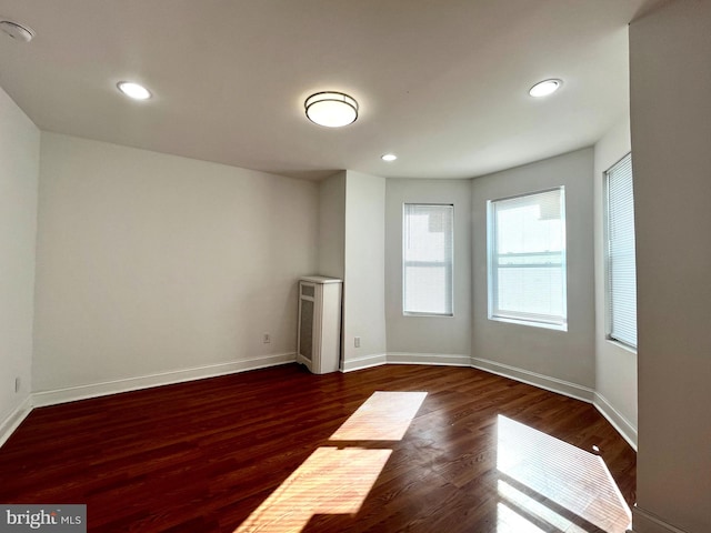 spare room featuring dark hardwood / wood-style flooring