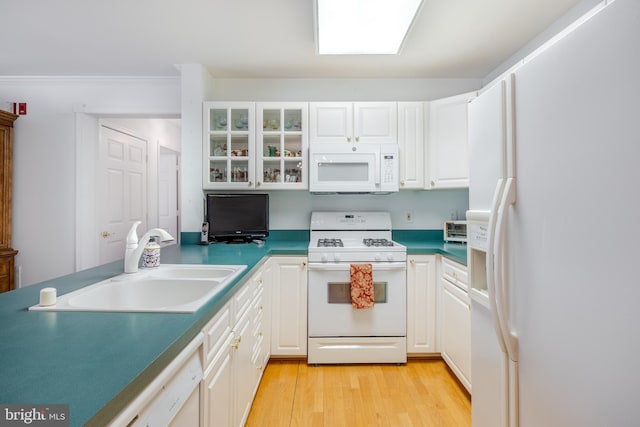 kitchen featuring white cabinets, light hardwood / wood-style floors, white appliances, and sink