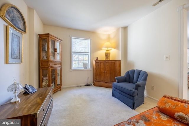 living area with light colored carpet