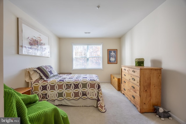 bedroom featuring light colored carpet