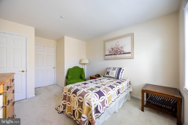 carpeted bedroom with a closet