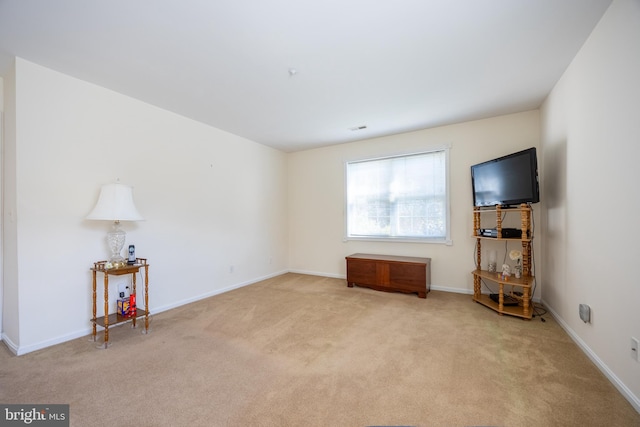 unfurnished living room featuring carpet