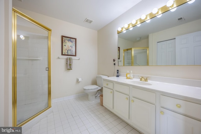 bathroom featuring tile patterned floors, vanity, toilet, and walk in shower