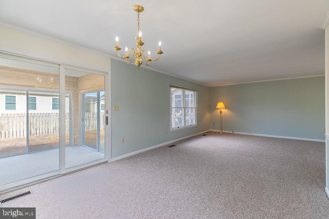 carpeted empty room with a wealth of natural light, a notable chandelier, and crown molding