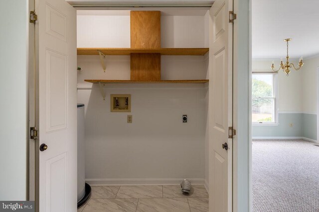8 Crossgate Dr Unit 8, Seaford, DE 19973 - washroom featuring hookup for a washing machine, baseboards, hookup for an electric dryer, a chandelier, and light marble finish floors
