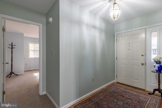 view of carpeted entrance foyer