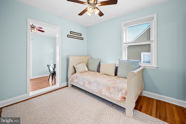 bedroom with wood-type flooring and ceiling fan