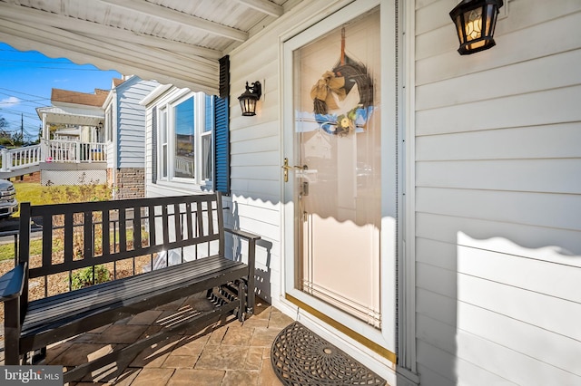 doorway to property featuring a porch