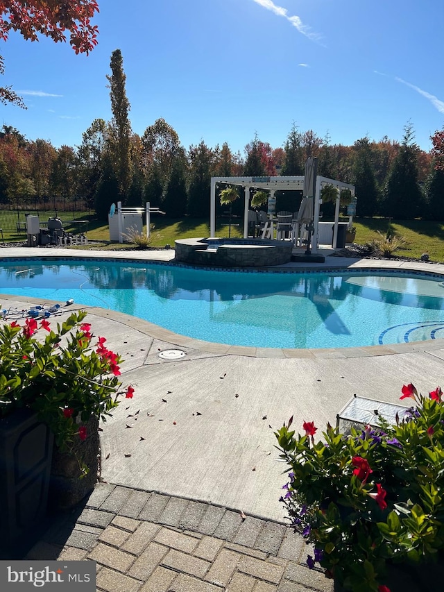 view of pool featuring an in ground hot tub, a pergola, and a patio