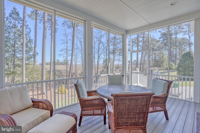 sunroom / solarium featuring a healthy amount of sunlight