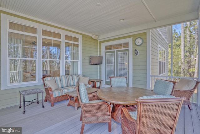 wooden terrace featuring outdoor dining space