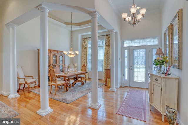 23298 Horse Island Rd, Lewes, DE 19958 - foyer featuring ornamental molding, light wood-style flooring, a chandelier, and a towering ceiling