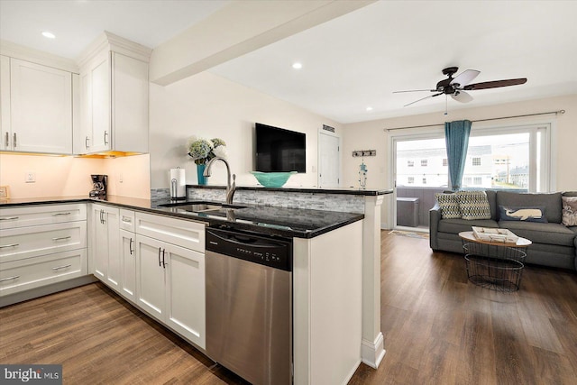 kitchen with dark hardwood / wood-style flooring, dishwasher, kitchen peninsula, white cabinets, and sink