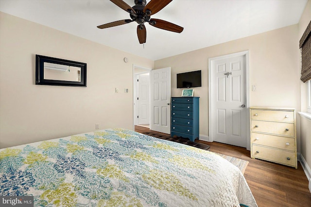 bedroom with hardwood / wood-style floors and ceiling fan